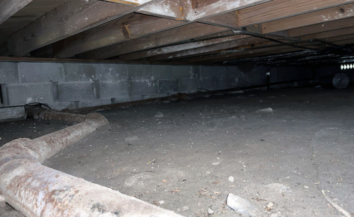 crawl space that needs insulation to keep the house warm and cool