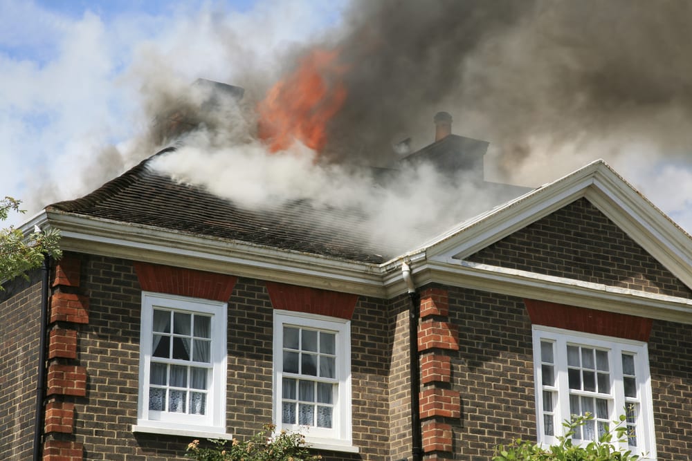 roof of house on fire caused by attic